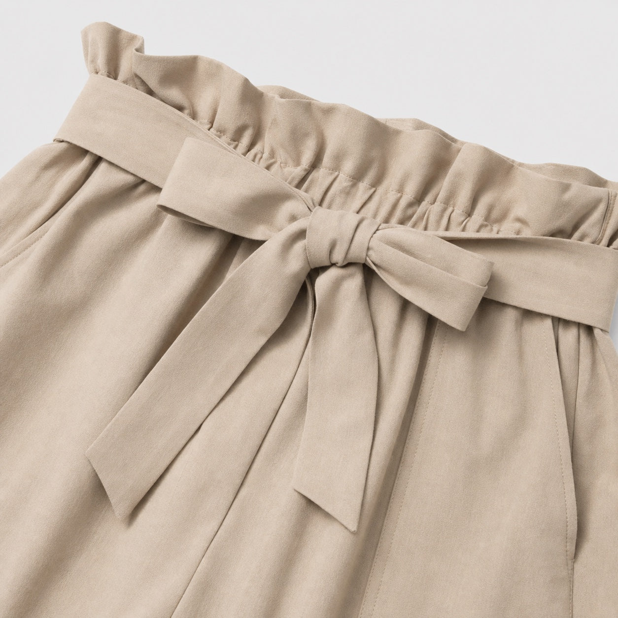Apricot paperbag-waist shorts detail