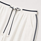 Women's white relaxed trousers detail view