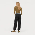 Women's black relaxed trousers back view