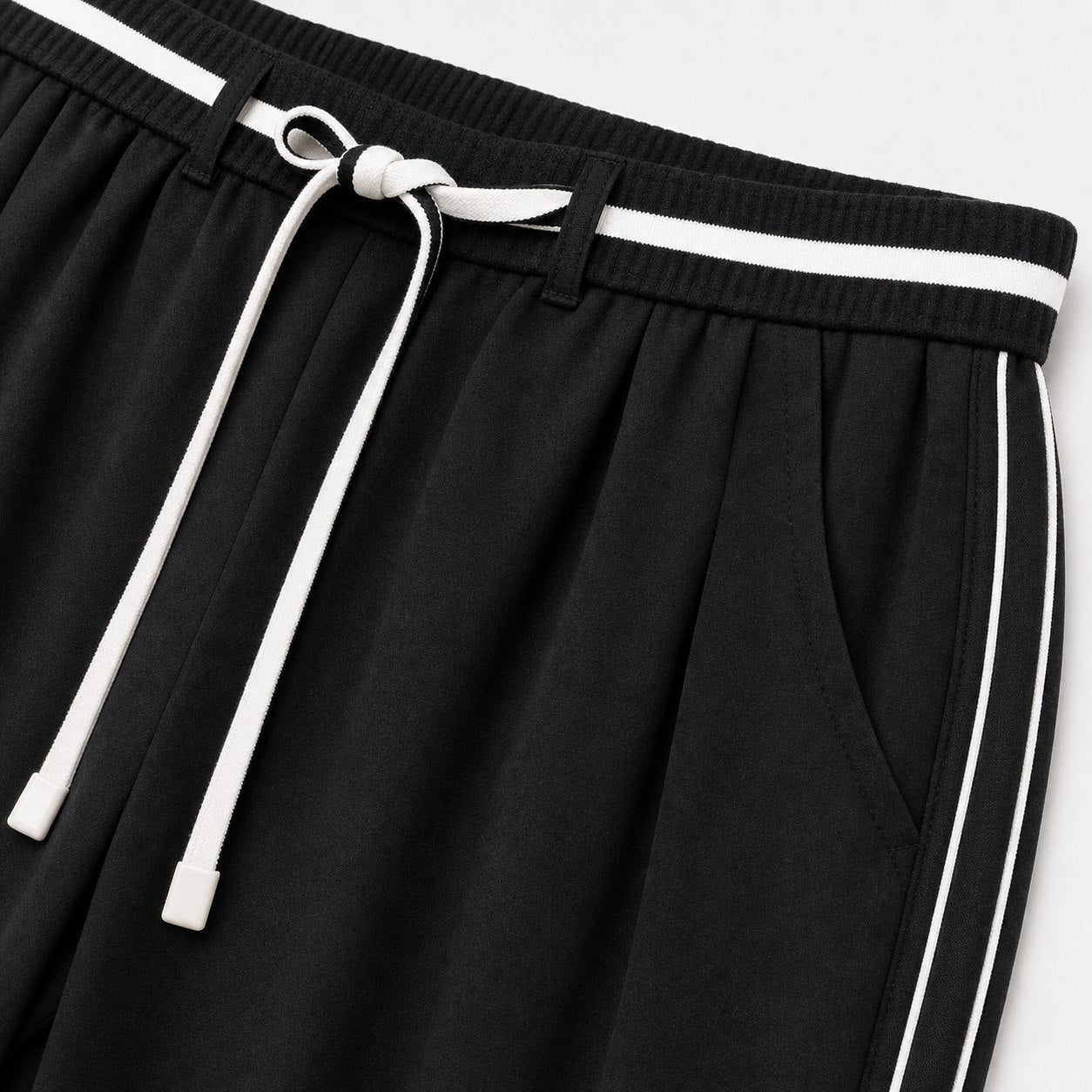 Women's black relaxed trousers detail view