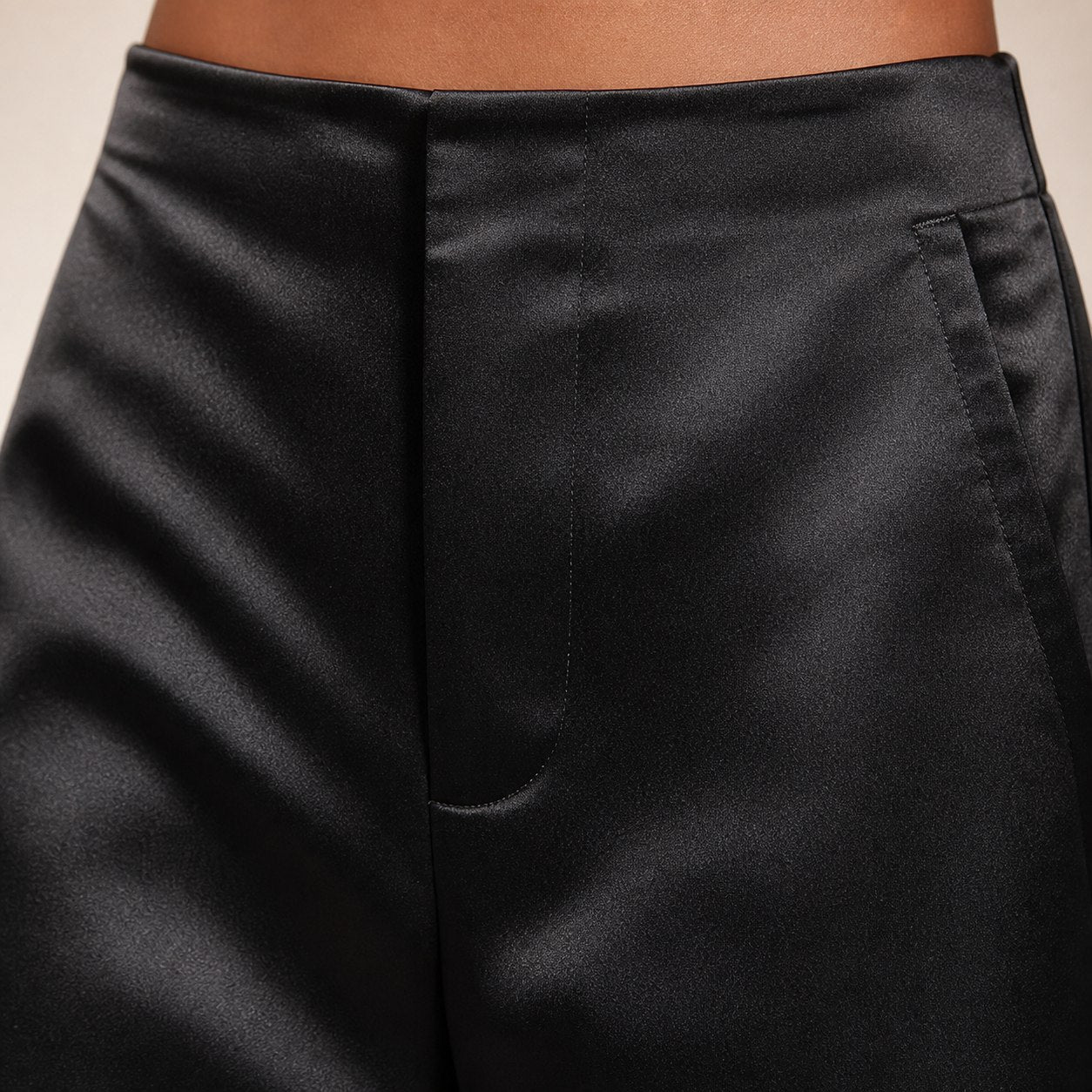 Black satin wide-leg trousers detail view