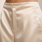 Apricot satin wide-leg trousers detail view