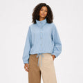 Women's blue striped high-collar top front view