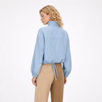 Women's blue striped high-collar top back view