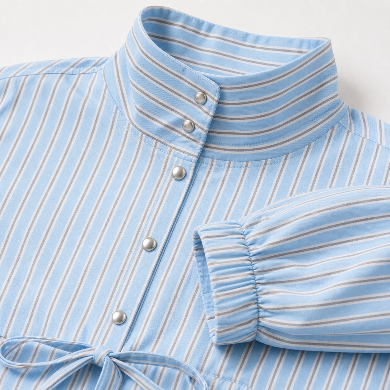 Women's blue striped high-collar top detail view