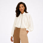 Women’s collared zip cape blouse in Milky White, front model view