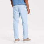 Men's light blue pinstripe pleated trousers back view