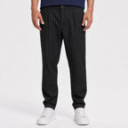 Men's black pinstripe pleated trousers front view