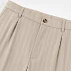 Men's beige pinstripe pleated trousers waistband detail