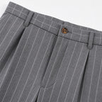 Men's grey pinstripe pleated trousers waistband detail