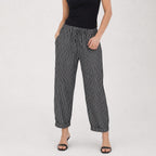 Black striped drawstring cropped trousers close view