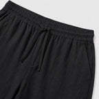 Black linen-look drawstring trousers detail