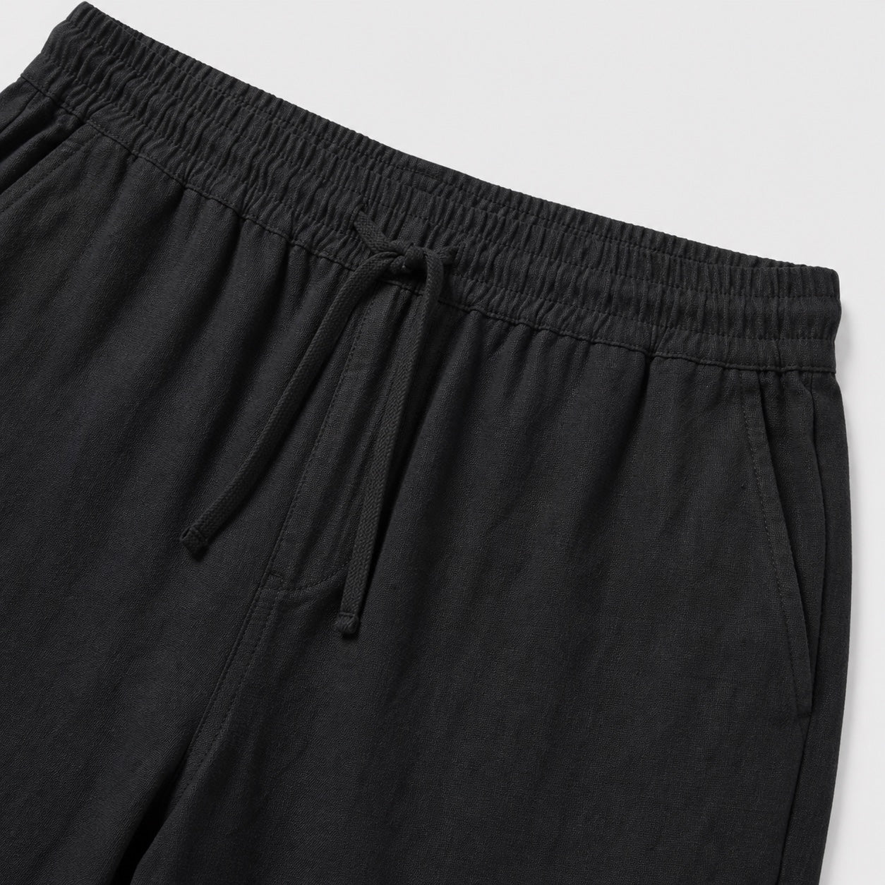 Black linen-look drawstring trousers detail
