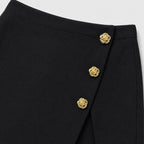 Black button-detail wrap-front skort detail