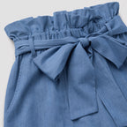 Blue paperbag-waist shorts detail