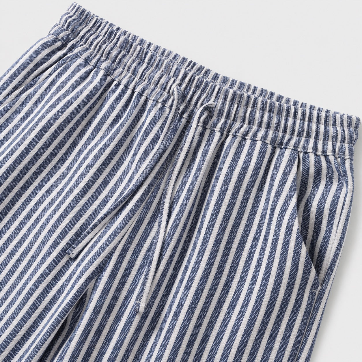 Blue striped drawstring cropped trousers detail