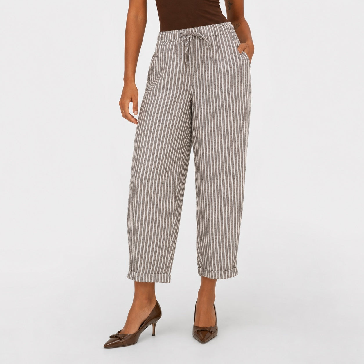 Brown striped drawstring cropped trousers close view