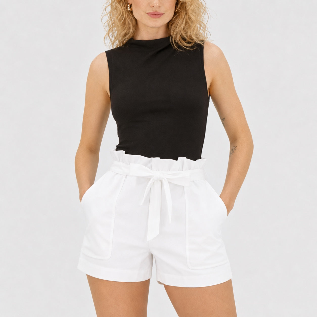 White paperbag-waist shorts close view