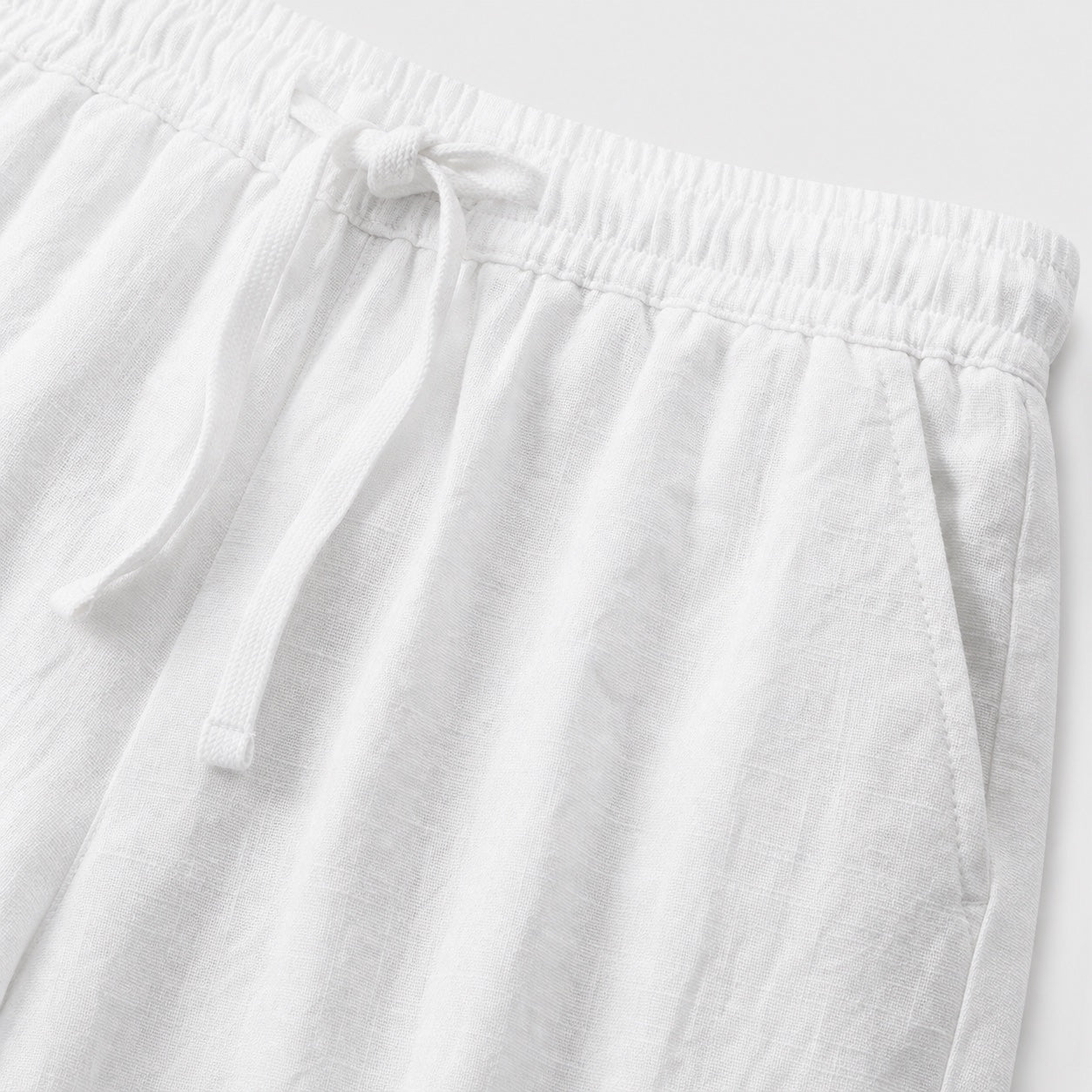 White linen-look drawstring trousers detail