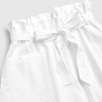 White paperbag-waist shorts detail