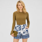 White and blue botanical shorts close view