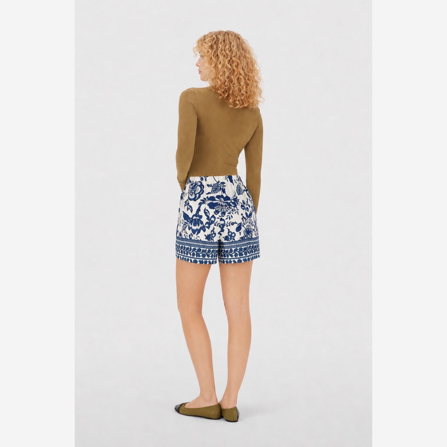 White and blue botanical shorts back