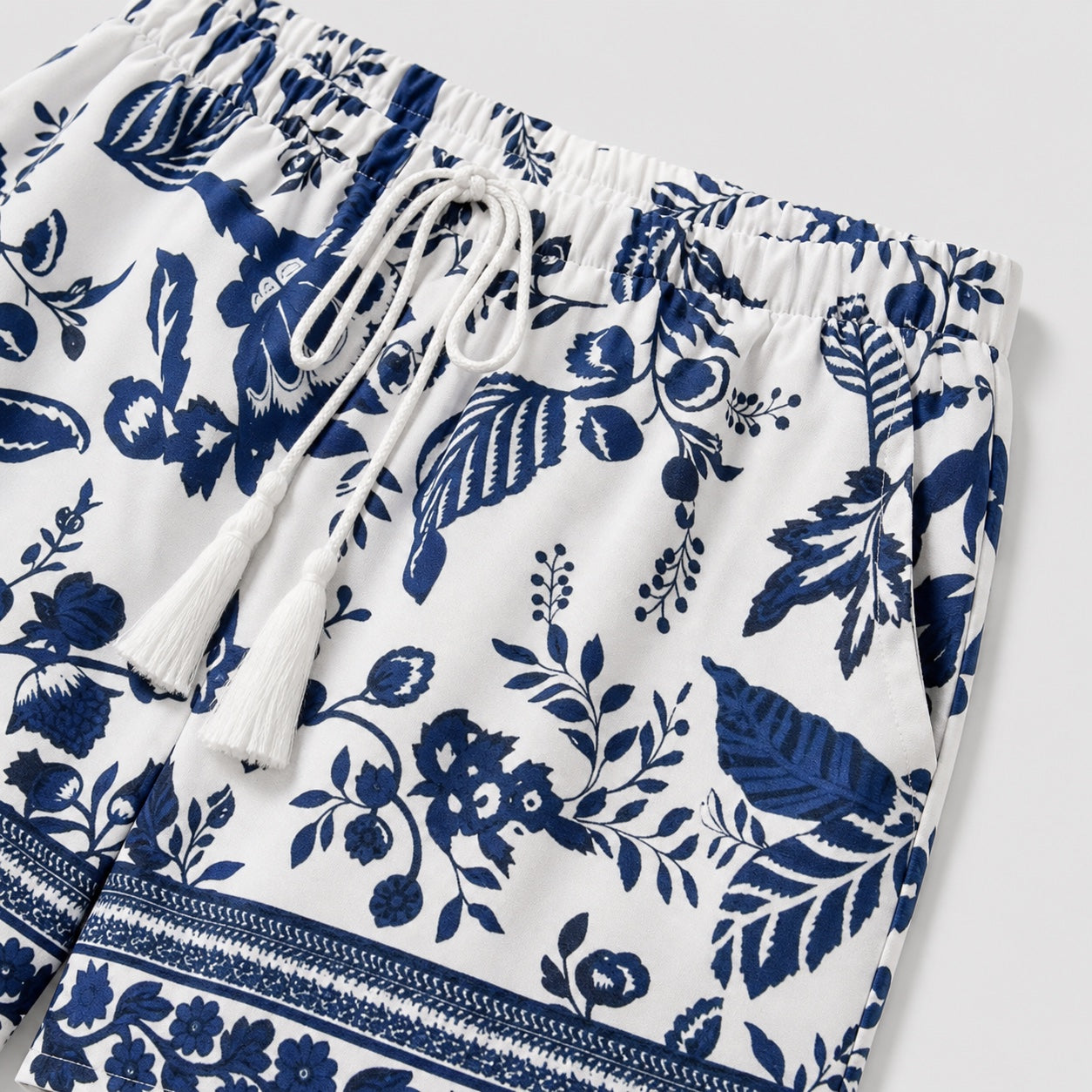 White and blue botanical shorts detail